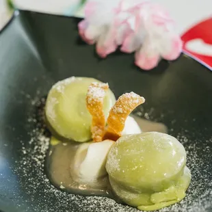 Green tea mochi ice cream with homemade lychee purée and homemade whipped cream.