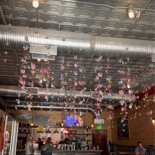 people sitting at tables in a restaurant