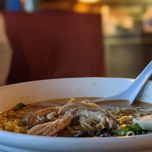 a bowl of ramen with a spoon in it
