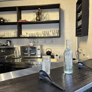 a bottle of water on a kitchen counter