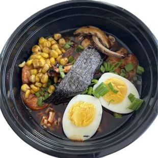 an overhead view of a bowl of ramen