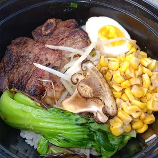 a bowl of ramen and vegetables