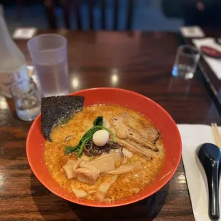 a bowl of ramen and a spoon
