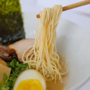 a bowl of ramen and an egg