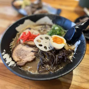 a bowl of ramen with a hard boiled egg