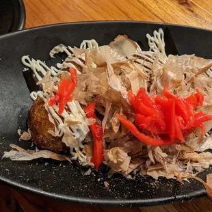a plate of food on a wooden table