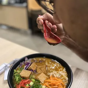 Vegetarian broth with traditional noodle tofu and toppings