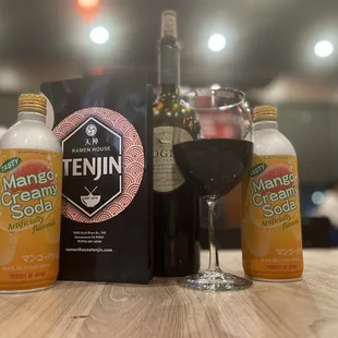a bottle of wine and a glass of wine