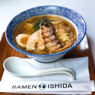 a bowl of ramen and a spoon