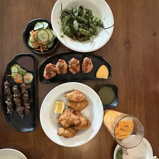 Chicken Wings, Shishito Pepper, BBQ Pork Skewers, Cucumber Salad, Spicy Tuna on Crispy Rice 4pcs, Thai Iced Tea