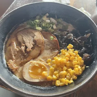 Tonkatsu Ramen - Hakata style, grill pork, wood ear, scallions, bamboo shoots, corn, 5-minute egg, black garlic oil.