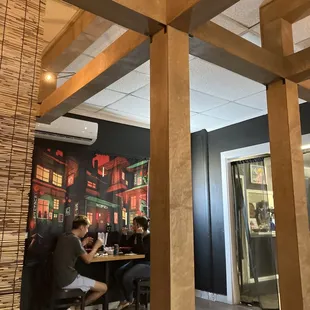 a group of people sitting at a table in a restaurant