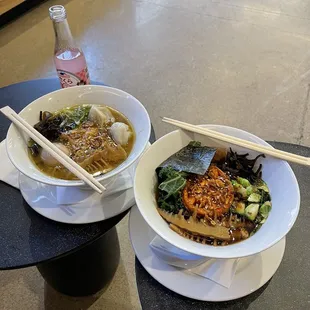 two bowls of ramen with chopsticks