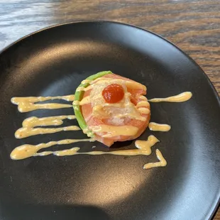 Salmon wrapped around rice