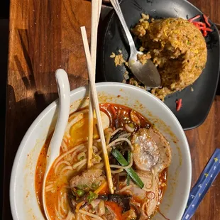 a bowl of ramen with chopsticks