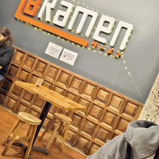  a man sitting at a table in a restaurant