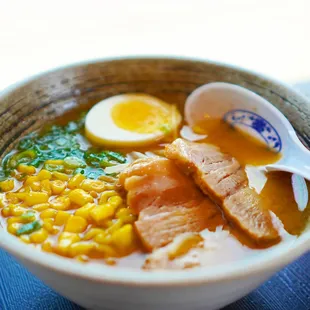 a bowl of ramen and a spoon