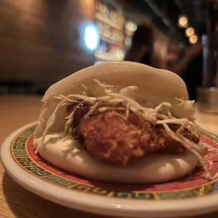 a pork bun on a plate