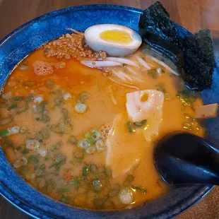 a bowl of ramen with a soft boiled egg