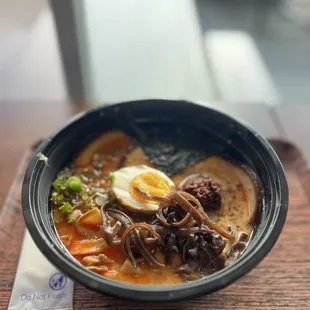 a bowl of ramen with an egg