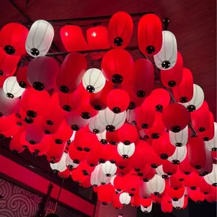 red and white lanterns hanging from the ceiling
