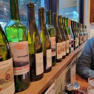 Empty bottles and bottles of wine.