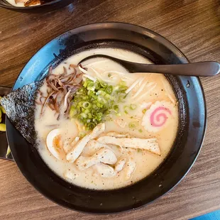 a bowl of ramen with a spoon in it