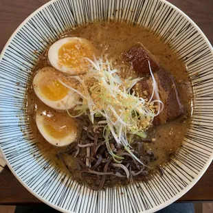 Mayu (black garlic) broth with thick noodles with extra seasoning egg.