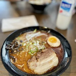 a bowl of ramen with an egg