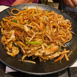 a plate of stir fried noodles