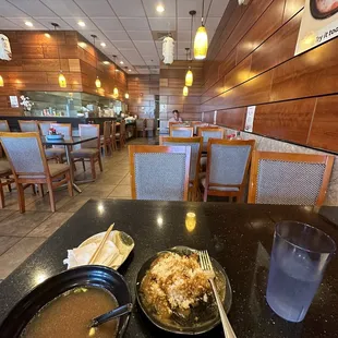 a bowl of ramen and a bowl of soup on a table in a restaurant