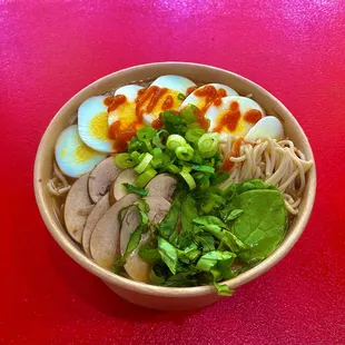 a bowl of ramen with a hard boiled egg