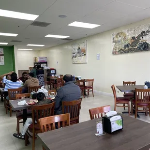 a group of people sitting at tables