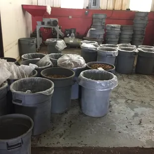 a room full of buckets of food