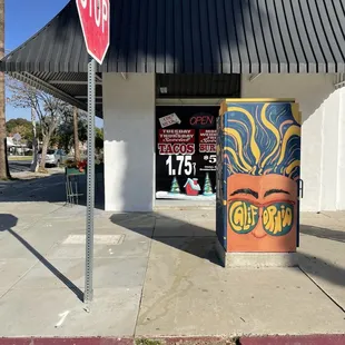 a stop sign in front of a store