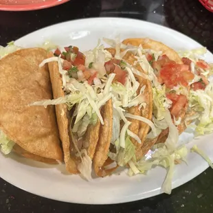 Taco Tuesday special 1.75 each shredded beef, chicken, ground beef, potato and bean taco.