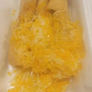 3 rolled tacos with cheese