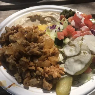 Chicken with hummus and salad plate