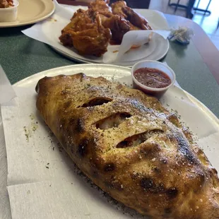 3 Topping Calzone &amp; 12 Oz. Soda Special Chicken Wing Deal