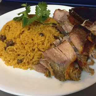 a plate of meat and rice