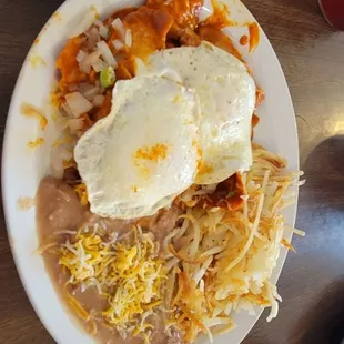 Chilaquiles Rojas. Very different flavor profile from what we're used to back home in CA