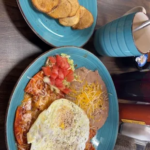 Papas, chilaquiles, refried beans and over medium eggs!  With a side of coffee lol