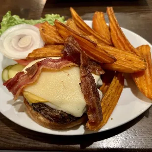 Ultimate bacon cheeseburger with sweet potato fries.