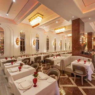 a dining room with tables and chairs