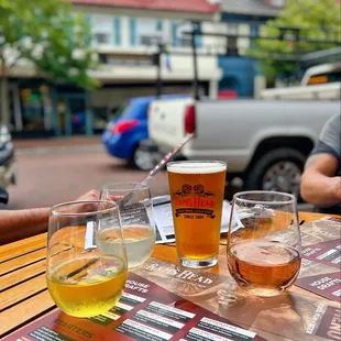 three glasses of beer on a table