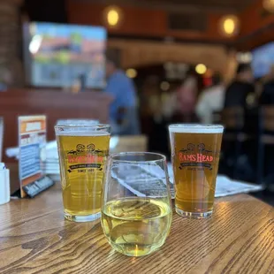 two glasses of beer on a table