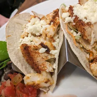 two fish tacos on a plate