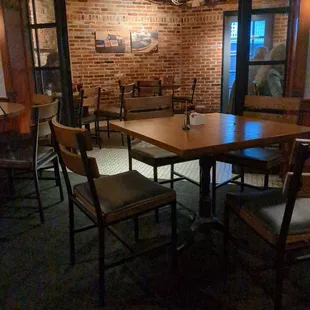 tables and chairs in a dimly lit room