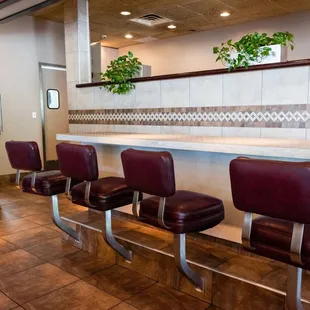 a row of chairs in a restaurant
