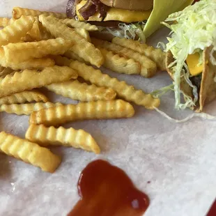 Bacon cheeseburger with grilled onions, fries &amp; beef hard shell taco